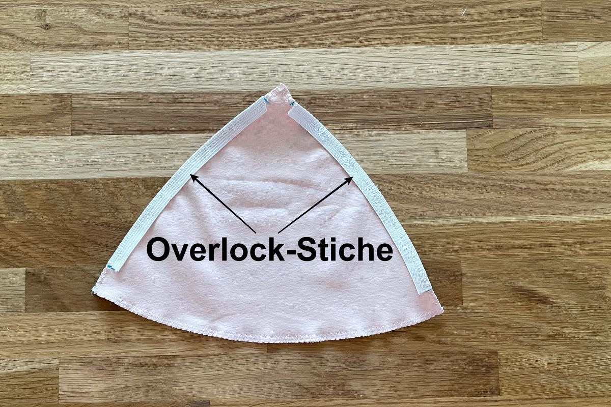 Sew elastic with overlock stitch on bikini top